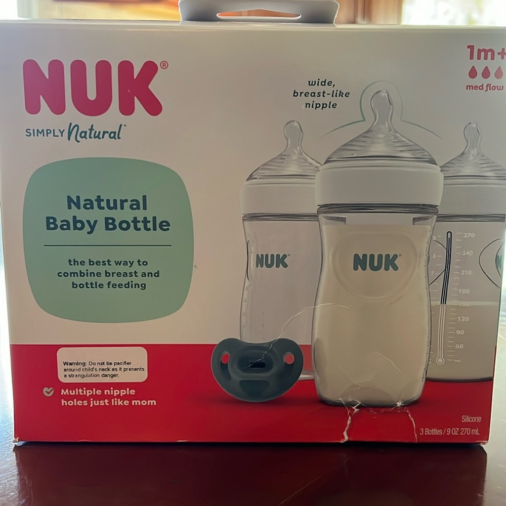 Brand New/ Unopened!!!   3 pack 1month+ 3 pack nik simply natural bottles.
